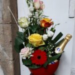 fleurs et champagne en vase